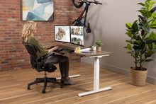 Load image into Gallery viewer, wood adjustable desk, sit-to-stand base model in plank coffee oak
